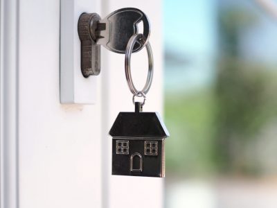 The house key for unlocking a new house is plugged into the door. The house key for unlocking a new house is plugged into the door.